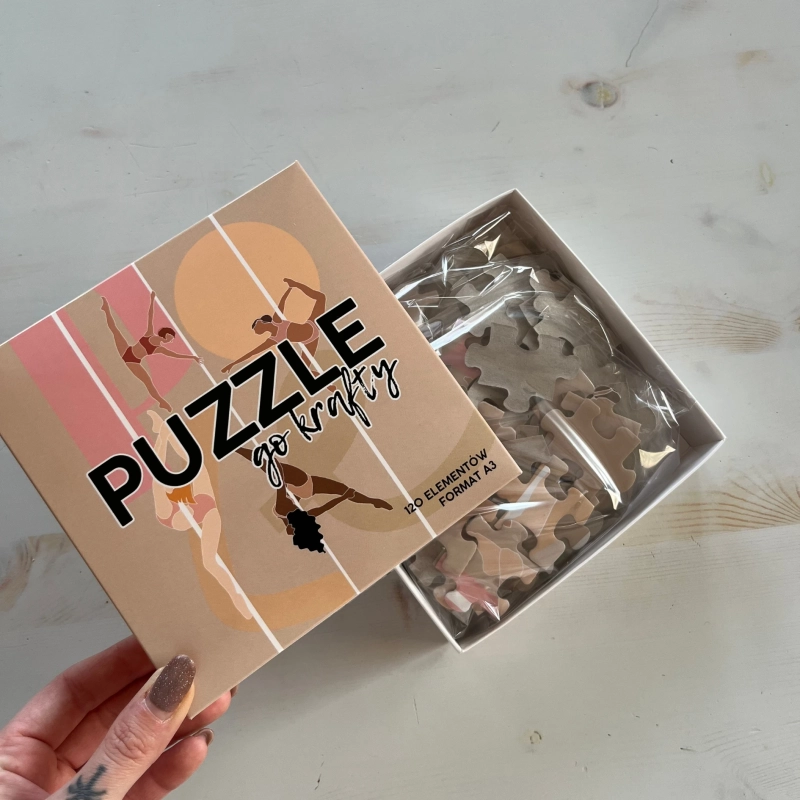 Puzzle Pole Dance — otwarte pudełko z elementami układanki
